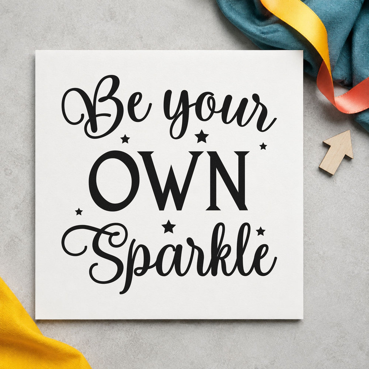 Be Your Own Sparkle craft stamp imprint in black ink on a handmade project, one idea being encouragement tags.