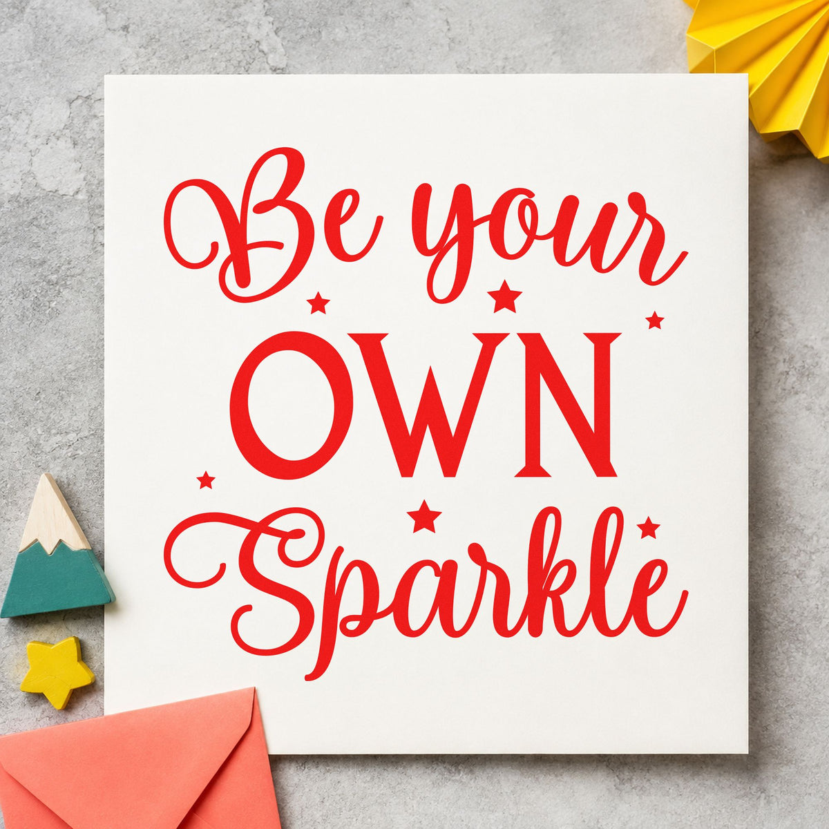 Be Your Own Sparkle craft stamp imprint in red ink on a handmade project, one idea being workshop seat slips.