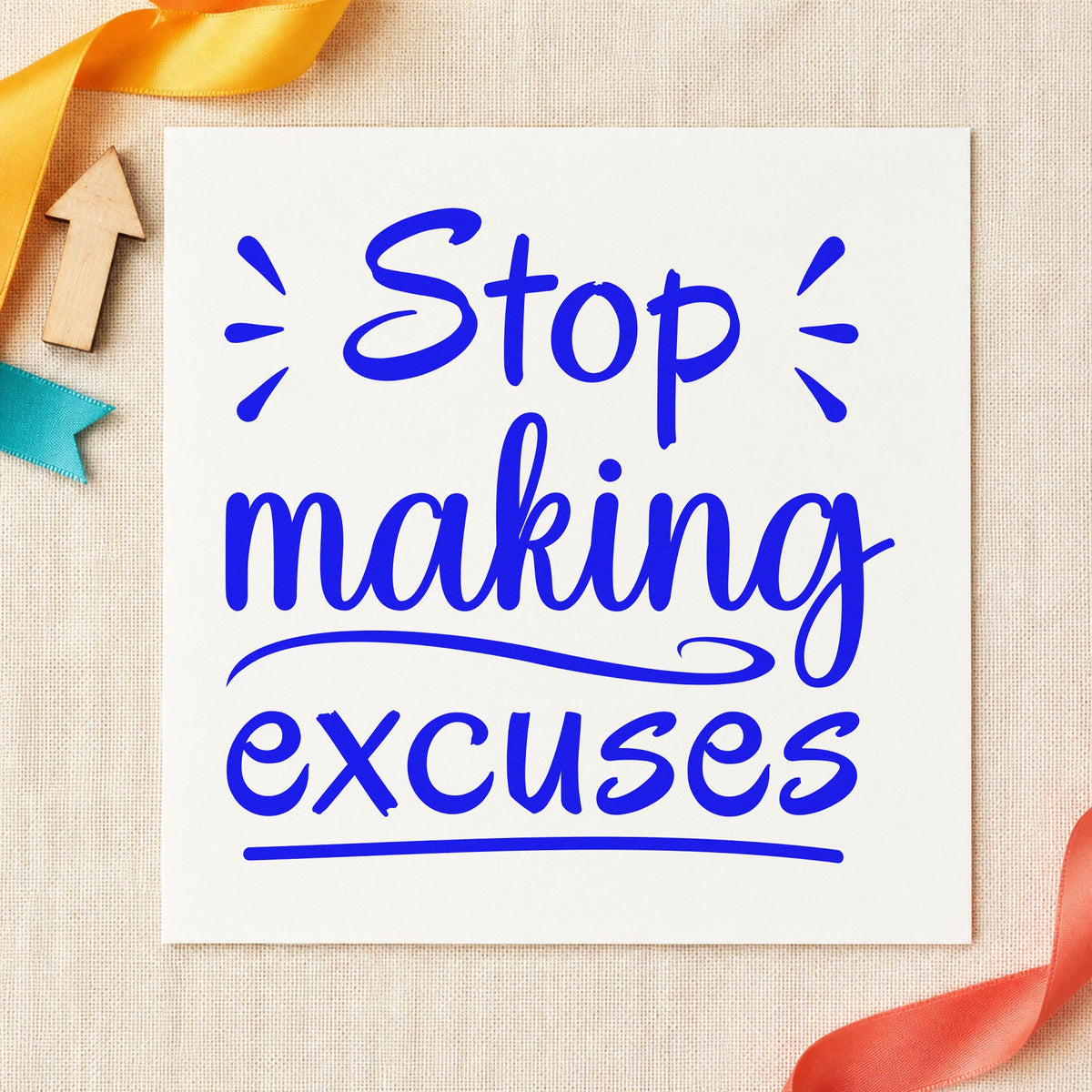 Stop Making Excuses Lettering craft stamp imprinted in blue ink on paper, a design suited to framed home gym.