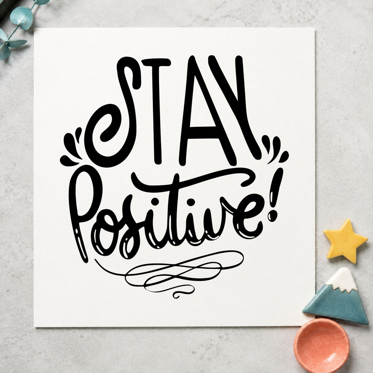 Stay Positive Decorative Script craft stamp imprint in black ink on a handmade project, one idea being locker name tags.