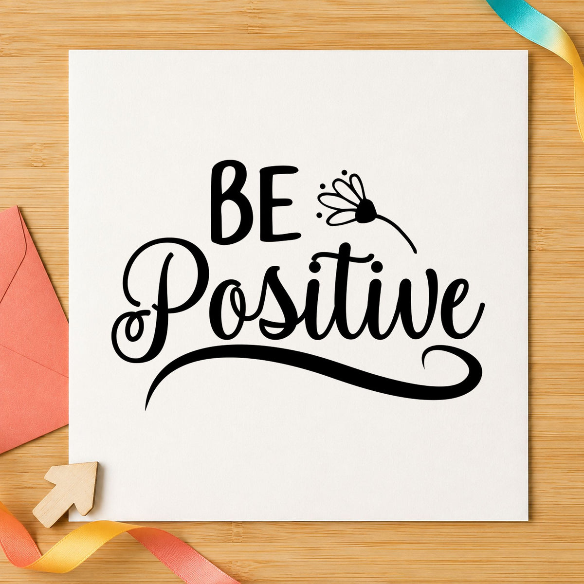 Be Positive Flower Script craft stamp imprint in black ink on a handmade project, one idea being stem wrap gift tags.