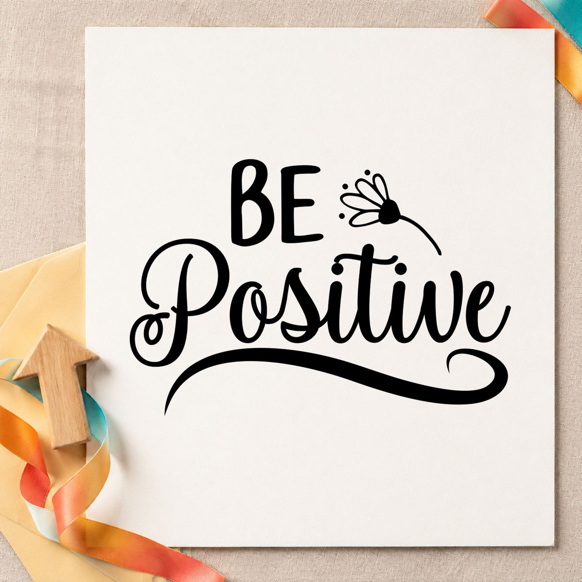 Be Positive Flower Script rubber stamp printed in black ink, ready for two word cards and similar paper crafts.
