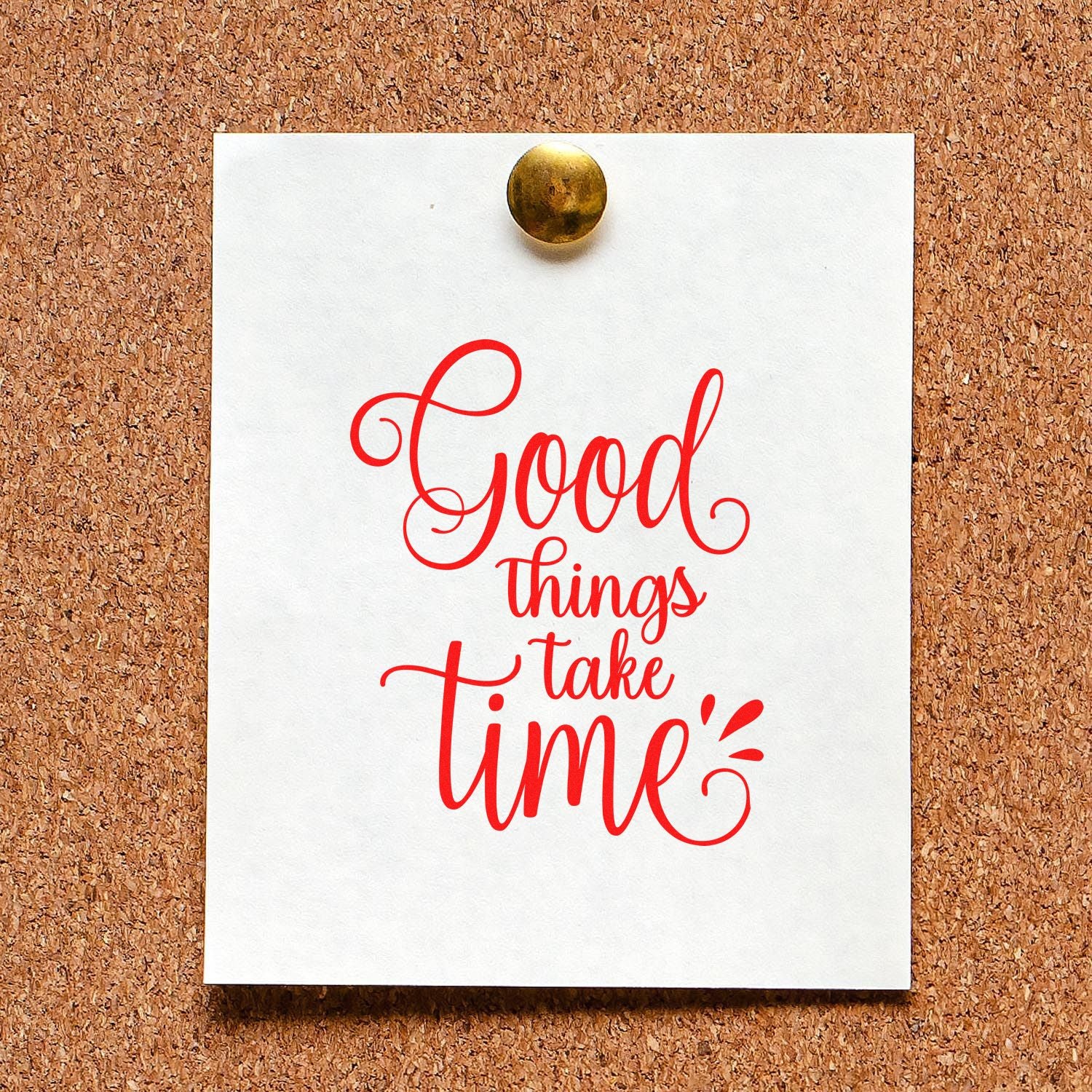 Custom rubber stamp design with Good things take time in red calligraphy on a pinned note against a corkboard.