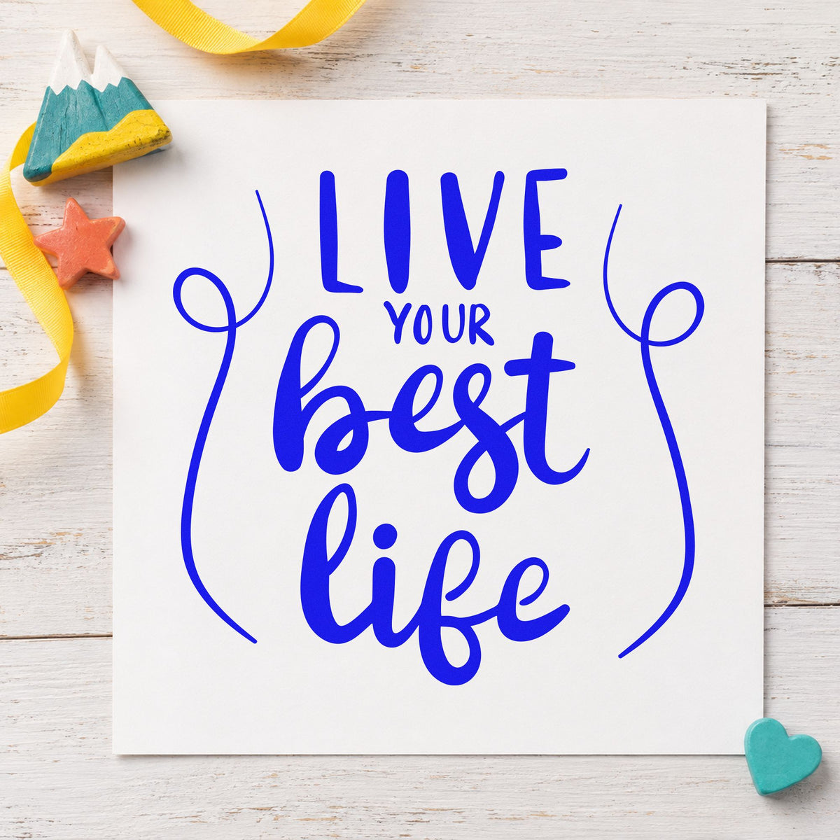 Live Your Best Life craft stamp in blue ink on cardstock, an easy option for packing cube printing.