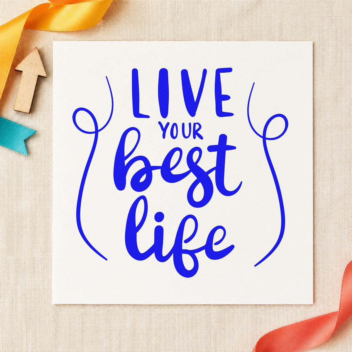 Live Your Best Life craft stamp imprinted in blue ink on paper, a design suited to framed map wall.