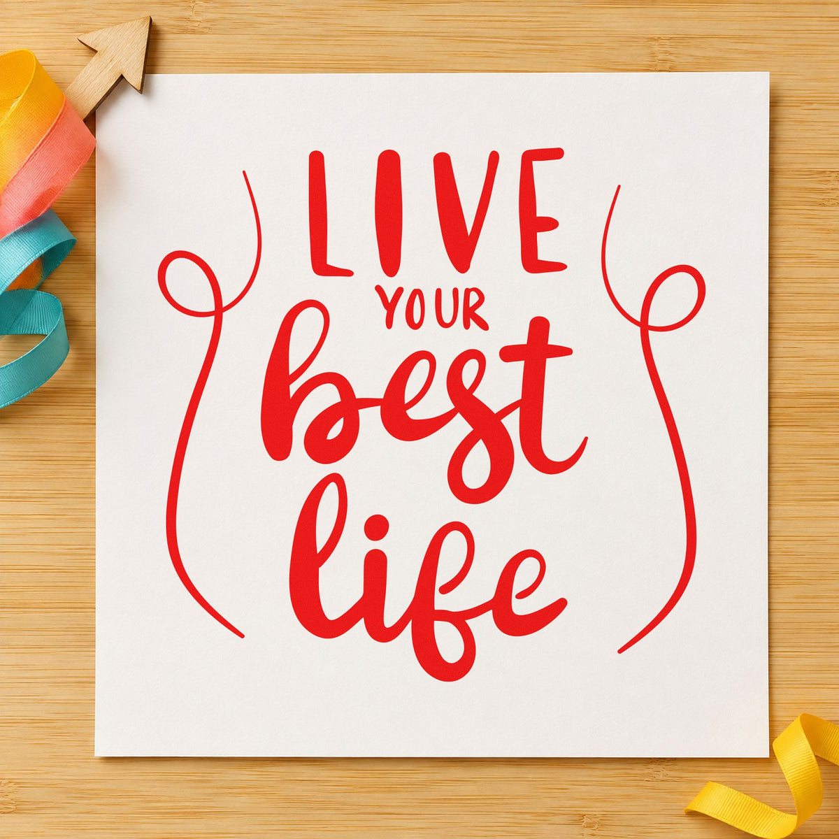 Live Your Best Life craft stamp imprint in red ink on a handmade project, one idea being trip recap cards.