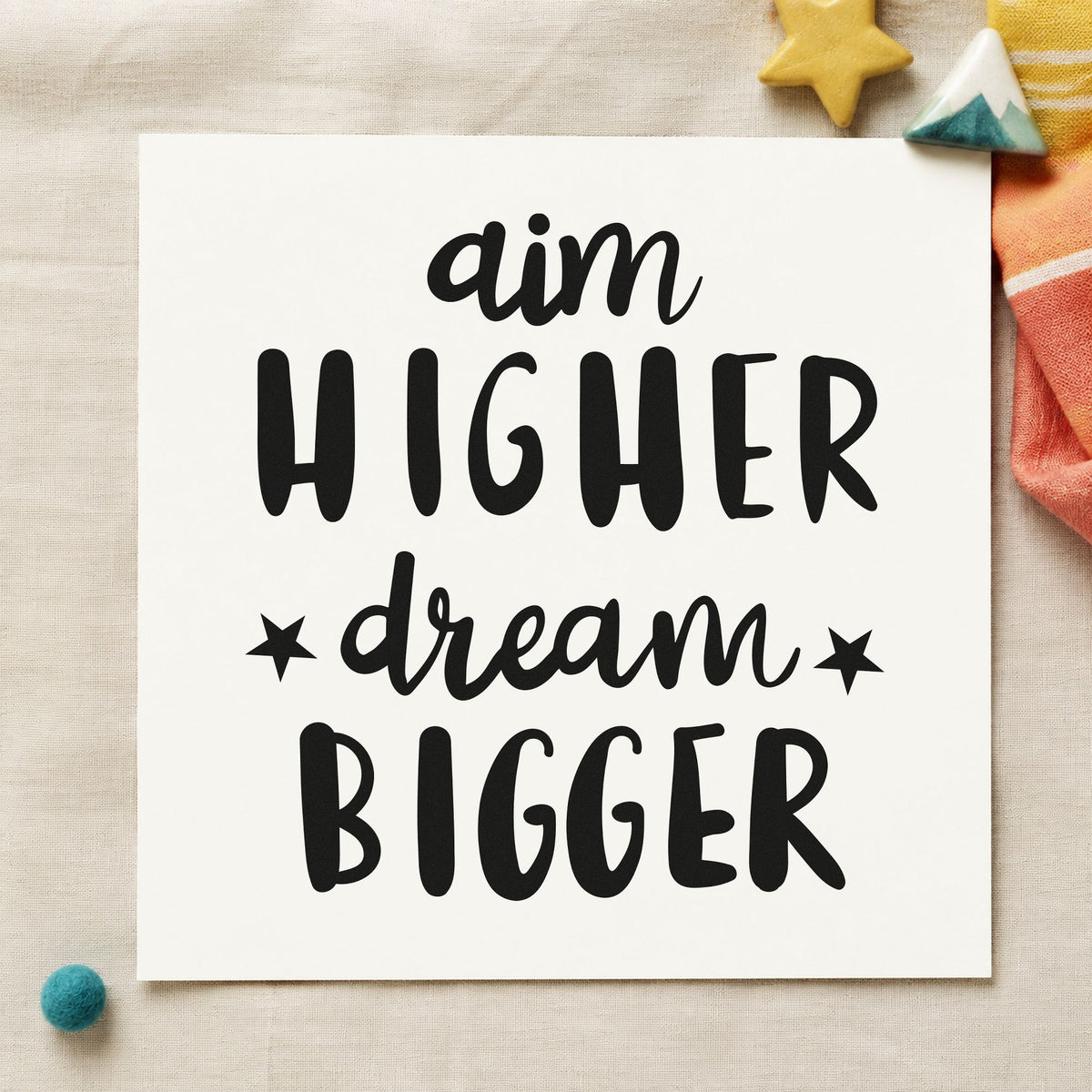Aim Higher Dream Bigger craft stamp imprint in black ink on a handmade project, one idea being model kit gift tags.