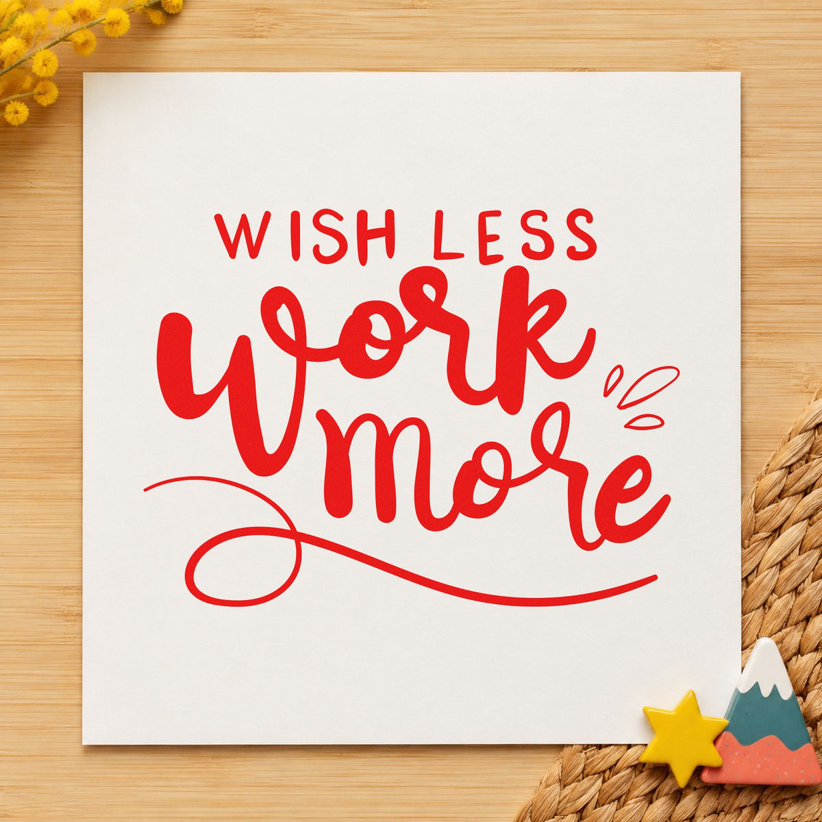 Wish Less Work More rubber stamp shown in red ink, stamped for projects such as cabinet bit labels.