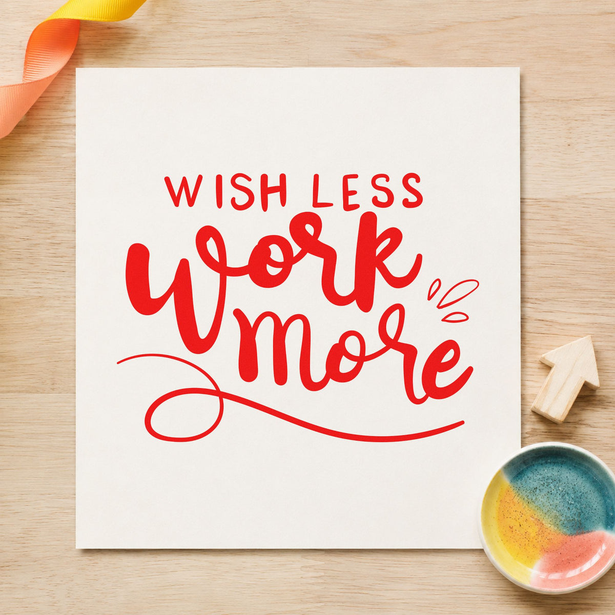 Wish Less Work More craft stamp imprint in red ink on a handmade project, one idea being hour tally cards.