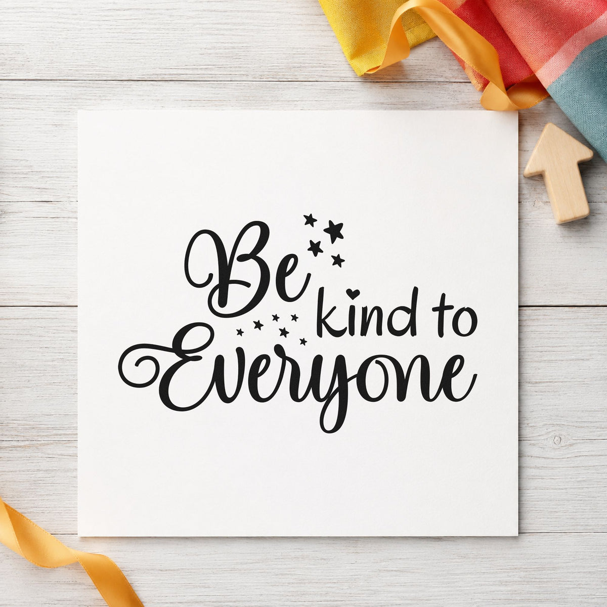 Be Kind To Everyone craft stamp imprint in black ink on a handmade project, one idea being reading buddy tags.