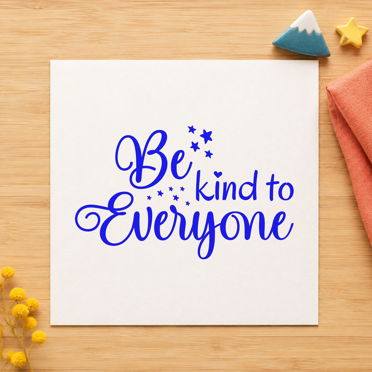 Be Kind To Everyone craft stamp imprinted in blue ink on paper, a design suited to framed reading nook.