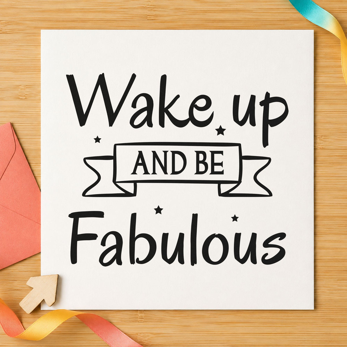 Wake Up And Be Fabulous craft stamp imprint in black ink on a handmade project, one idea being skincare set gift tags.
