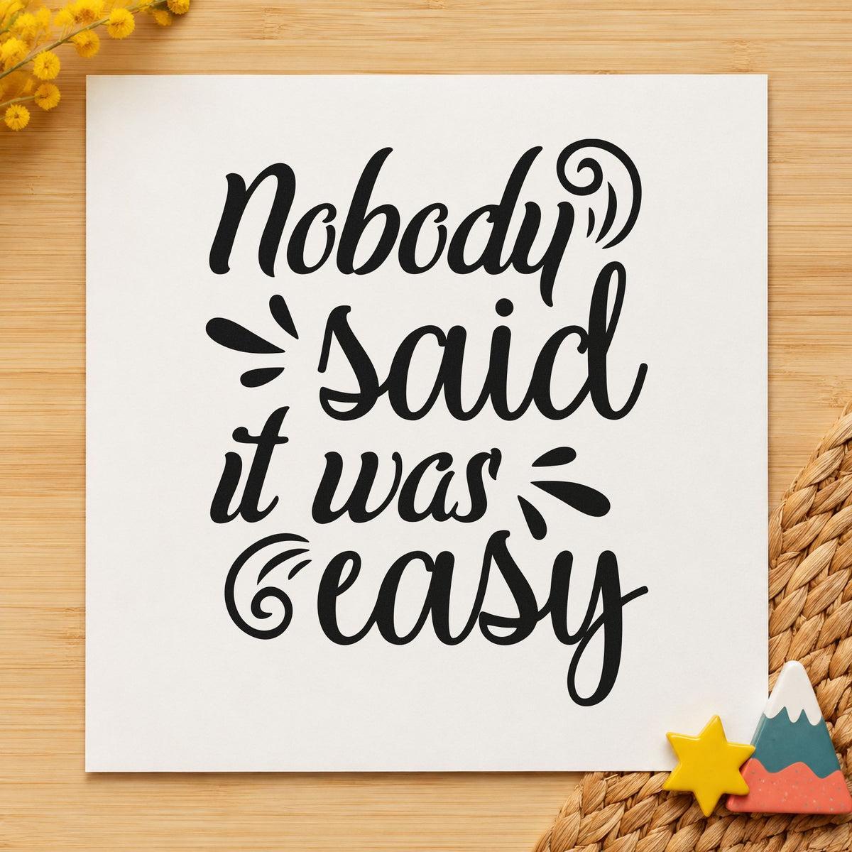 Nobody Said It Was Easy craft stamp imprint in black ink on a handmade project, one idea being chalk bag gift tags.