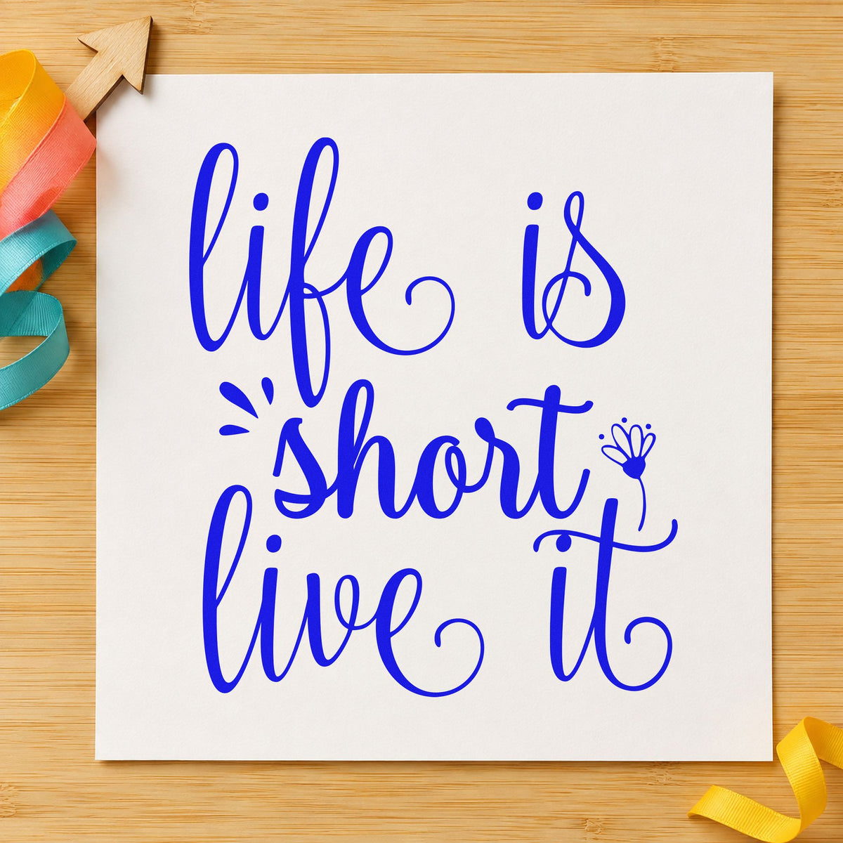 Life Is Short Live It craft stamp in blue ink on cardstock, an easy option for bandana printing.