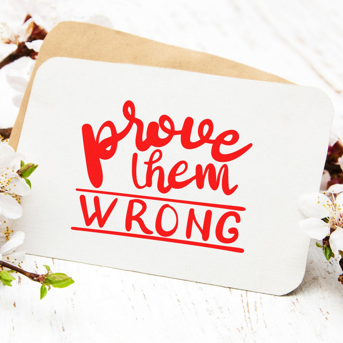 Prove Them Wrong Bold rubber stamp shown in red ink, stamped for projects such as pitch album page.