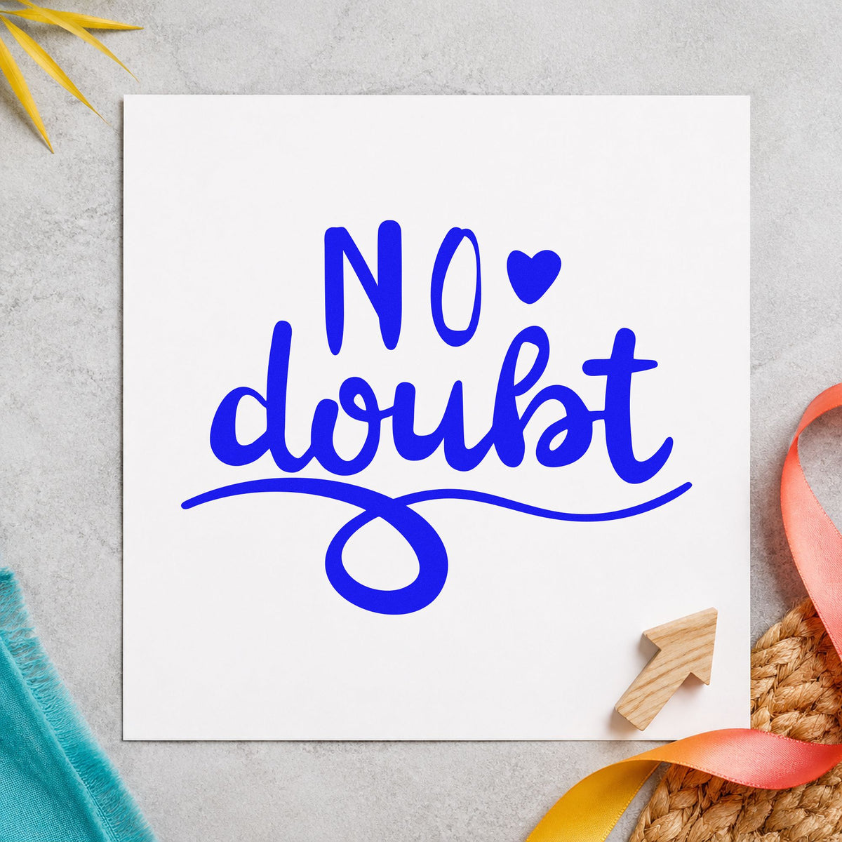 No Doubt Heart Flourish craft stamp in blue ink on cardstock, an easy option for arm guard printing.