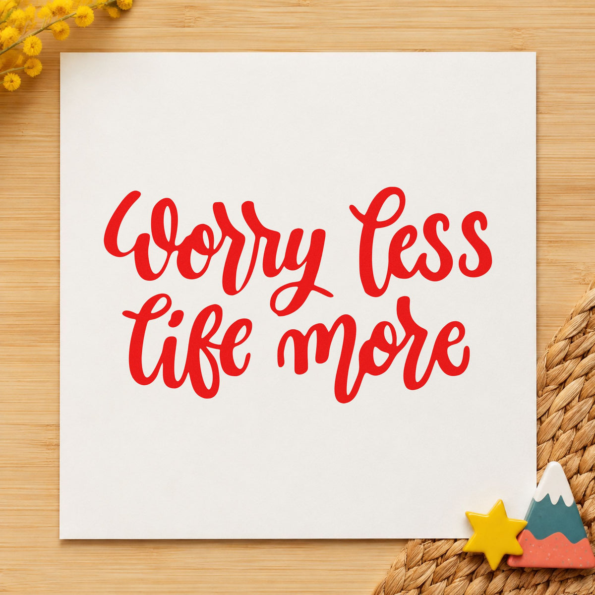 Worry Less Live More craft stamp imprint in red ink on a handmade project, one idea being cabin log cards.