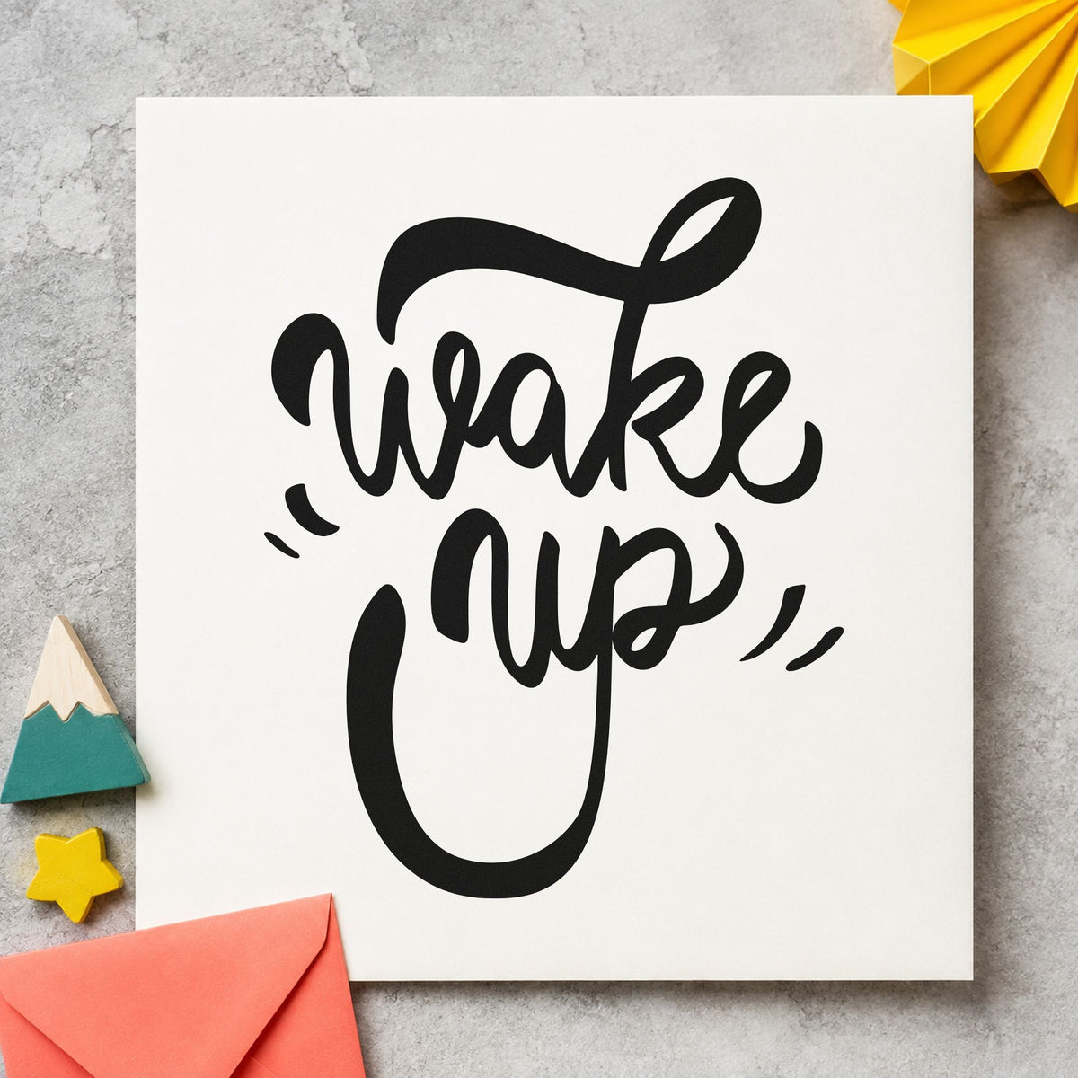 Wake Up Bold Script craft stamp imprint in black ink on a handmade project, one idea being loaf bag gift tags.