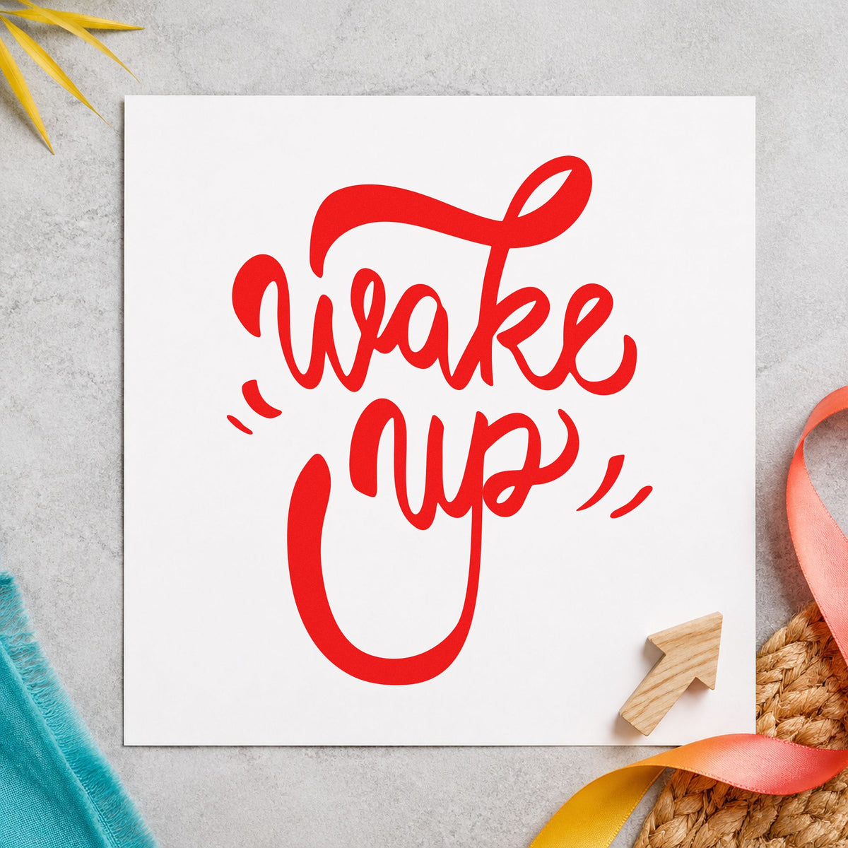Wake Up Bold Script craft stamp imprint in red ink on a handmade project, one idea being daily bake cards.