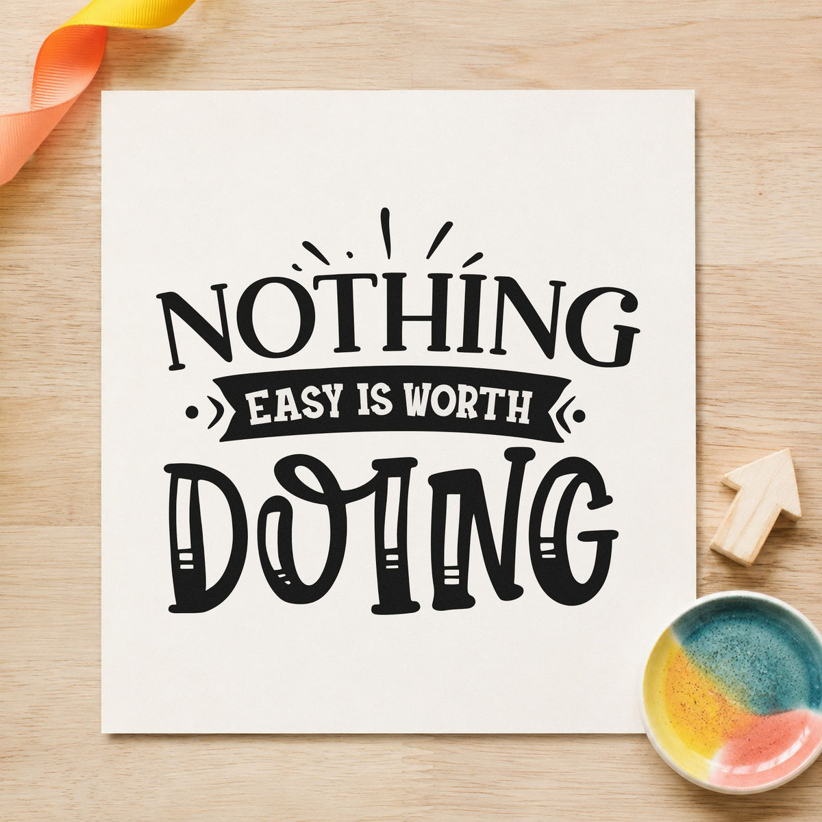 Nothing Easy Is Worth Doing craft stamp imprint in black ink on a handmade project, one idea being resupply box tags.