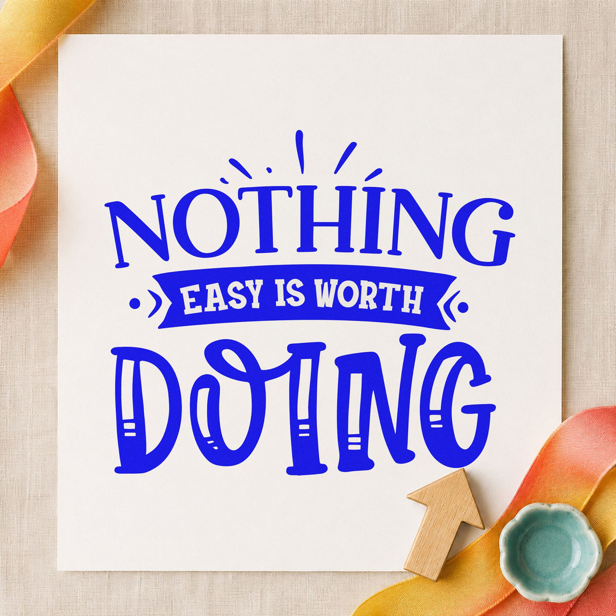 Nothing Easy Is Worth Doing craft stamp in blue ink on cardstock, an easy option for pack lid printing.