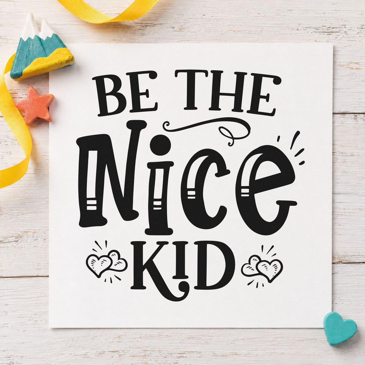 Be The Nice Kid craft stamp imprint in black ink on a handmade project, one idea being trunk gift tags.