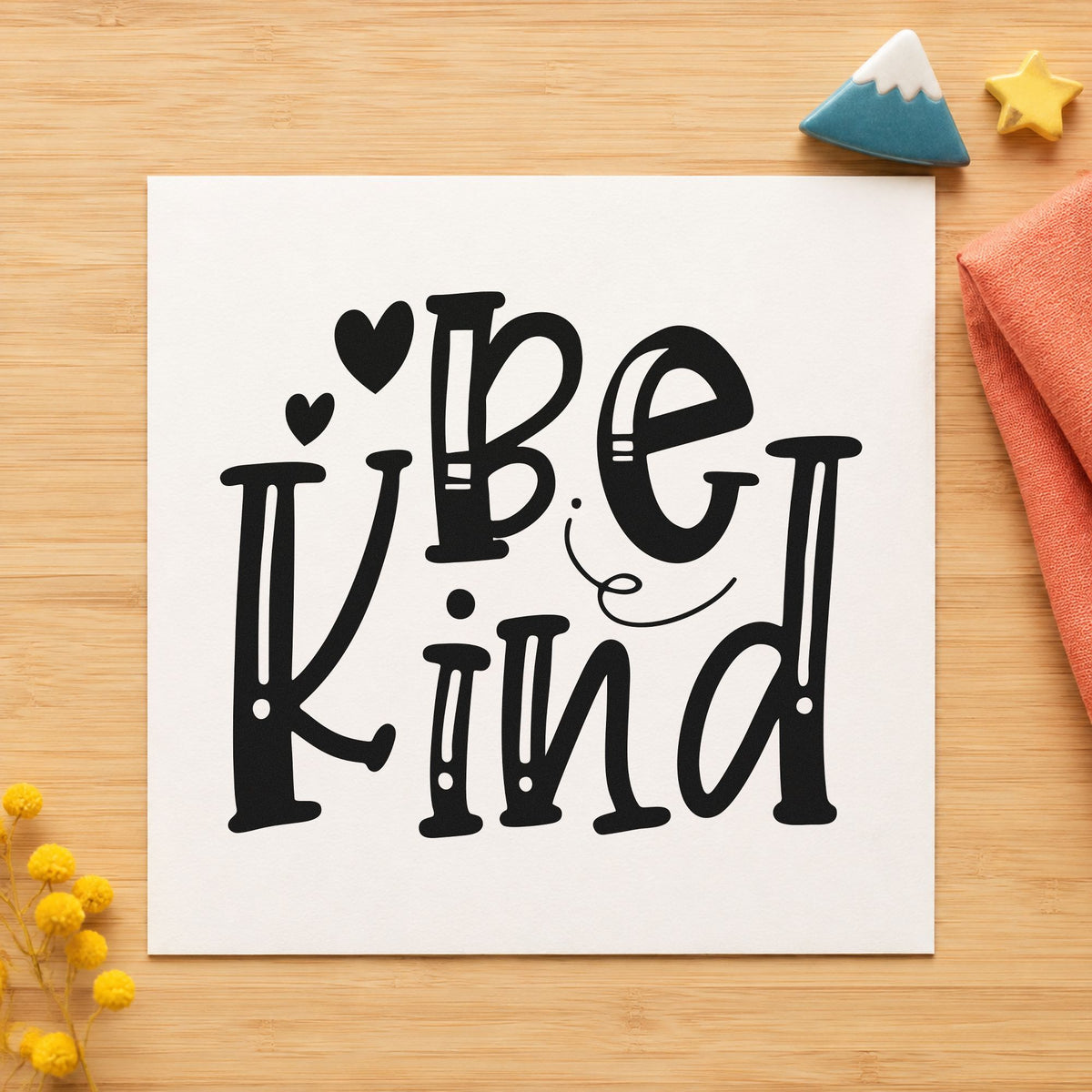 Be Kind Decorative Hearts craft stamp imprint in black ink on a handmade project, one idea being supply drop gift tags.