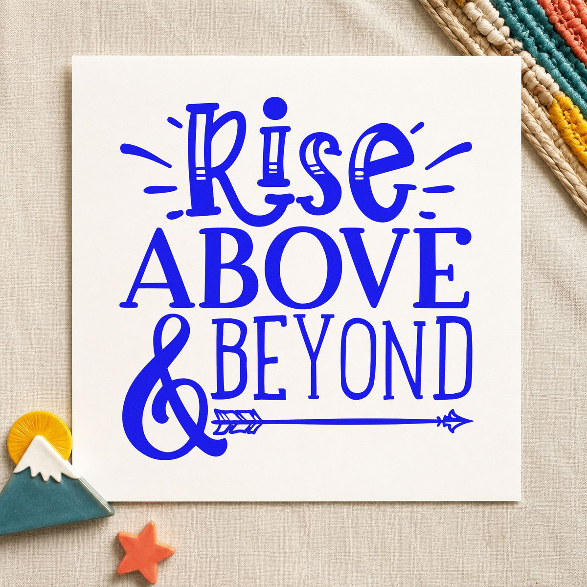 Rise Above And Beyond craft stamp in blue ink on cardstock, an easy option for crew vest printing.