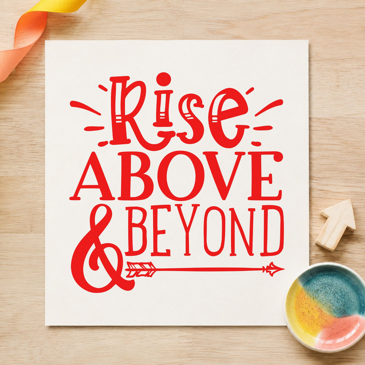 Rise Above And Beyond craft stamp imprint in red ink on a handmade project, one idea being flight log cards.