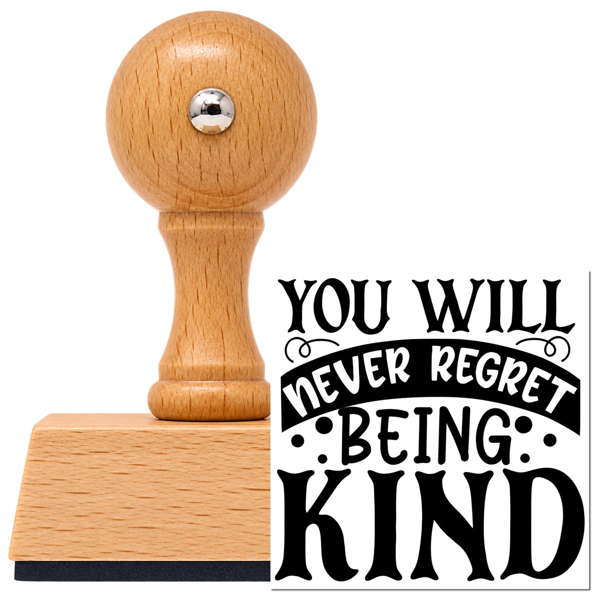 You Will Never Regret Being Kind Vintage Pro rubber stamp in European beech wood with a round knob handle, shown beside its black imprint.