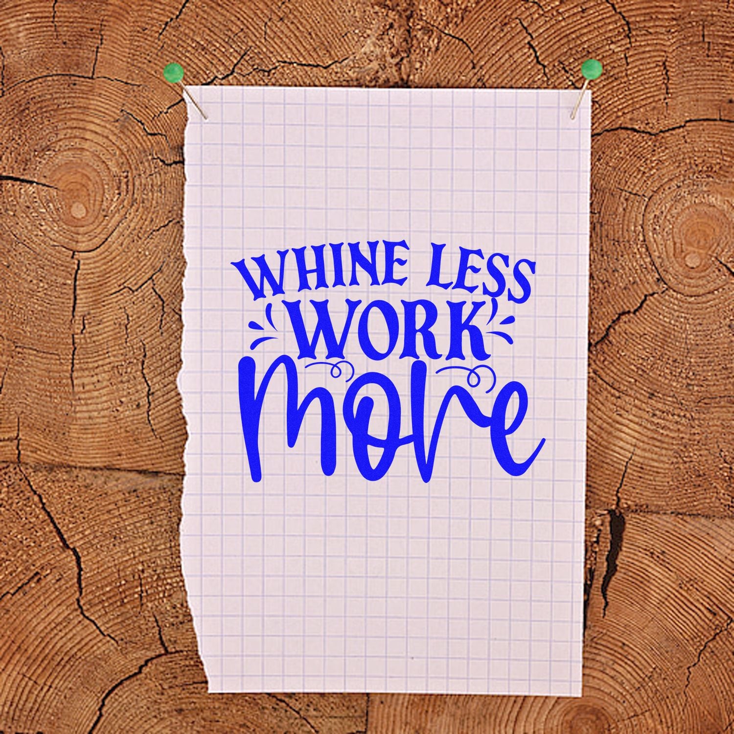 Whine Less Work More motivational rubber stamp design for office crafts, shown on pinned graph paper.