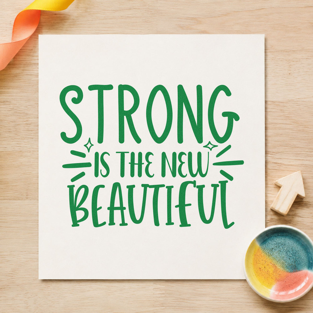 Strong New Beautiful Lettering craft stamp in green ink on cardstock, an easy option for regatta album page.