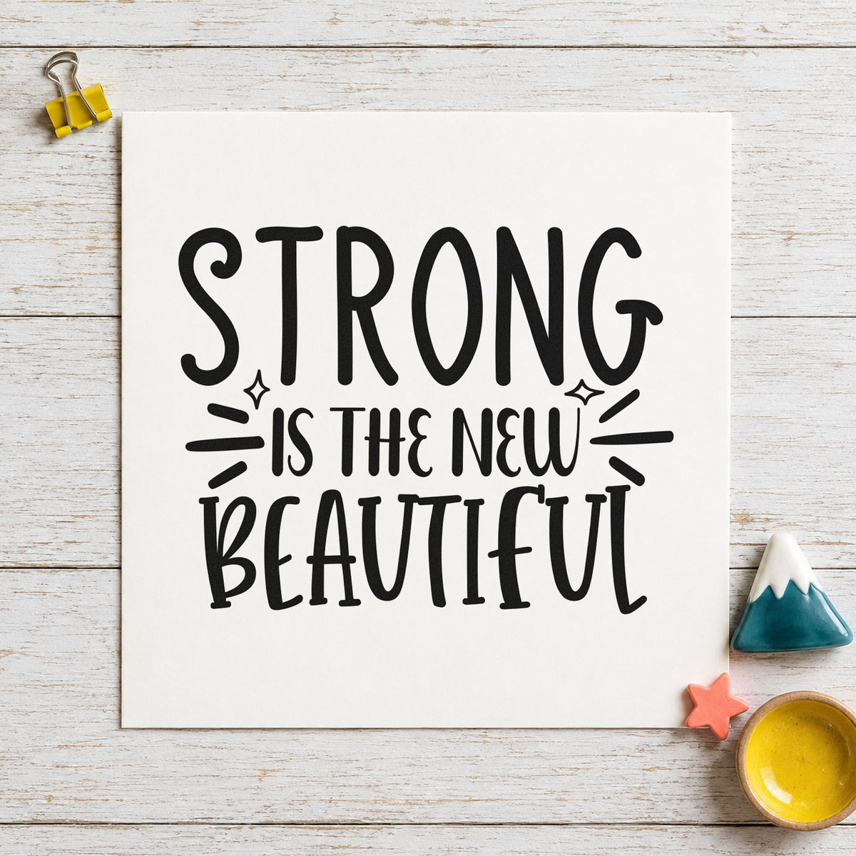 Strong New Beautiful Lettering craft stamp imprint in black ink on a handmade project, one idea being blade bag gift tags.
