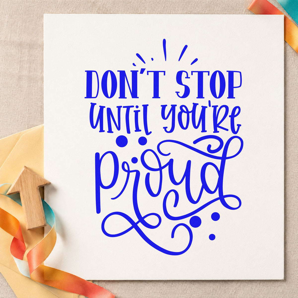 Don't Stop Until Proud craft stamp in blue ink on cardstock, an easy option for carry case printing.