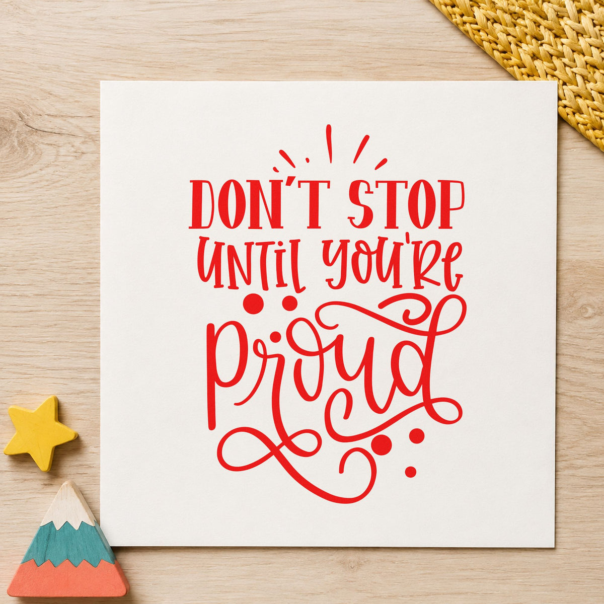 Don't Stop Until Proud craft stamp imprint in red ink on a handmade project, one idea being review note cards.