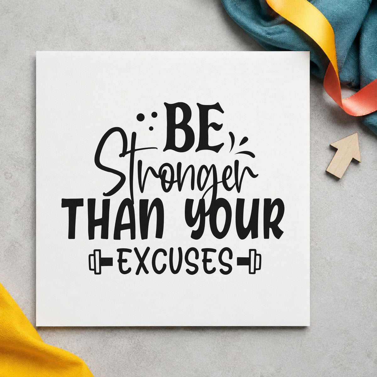 Be Stronger Than Excuses Dumbbells craft stamp imprint in black ink on a handmade project, one idea being towel set gift tags.
