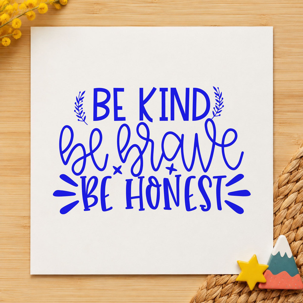 Be Kind Brave Honest craft stamp imprinted in blue ink on paper, a design suited to framed meeting hall.