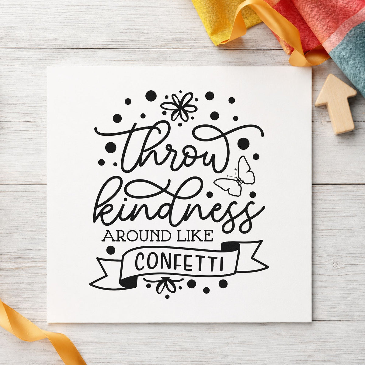 Throw Kindness Like Confetti craft stamp in black ink on cardstock, an easy option for mural album page.