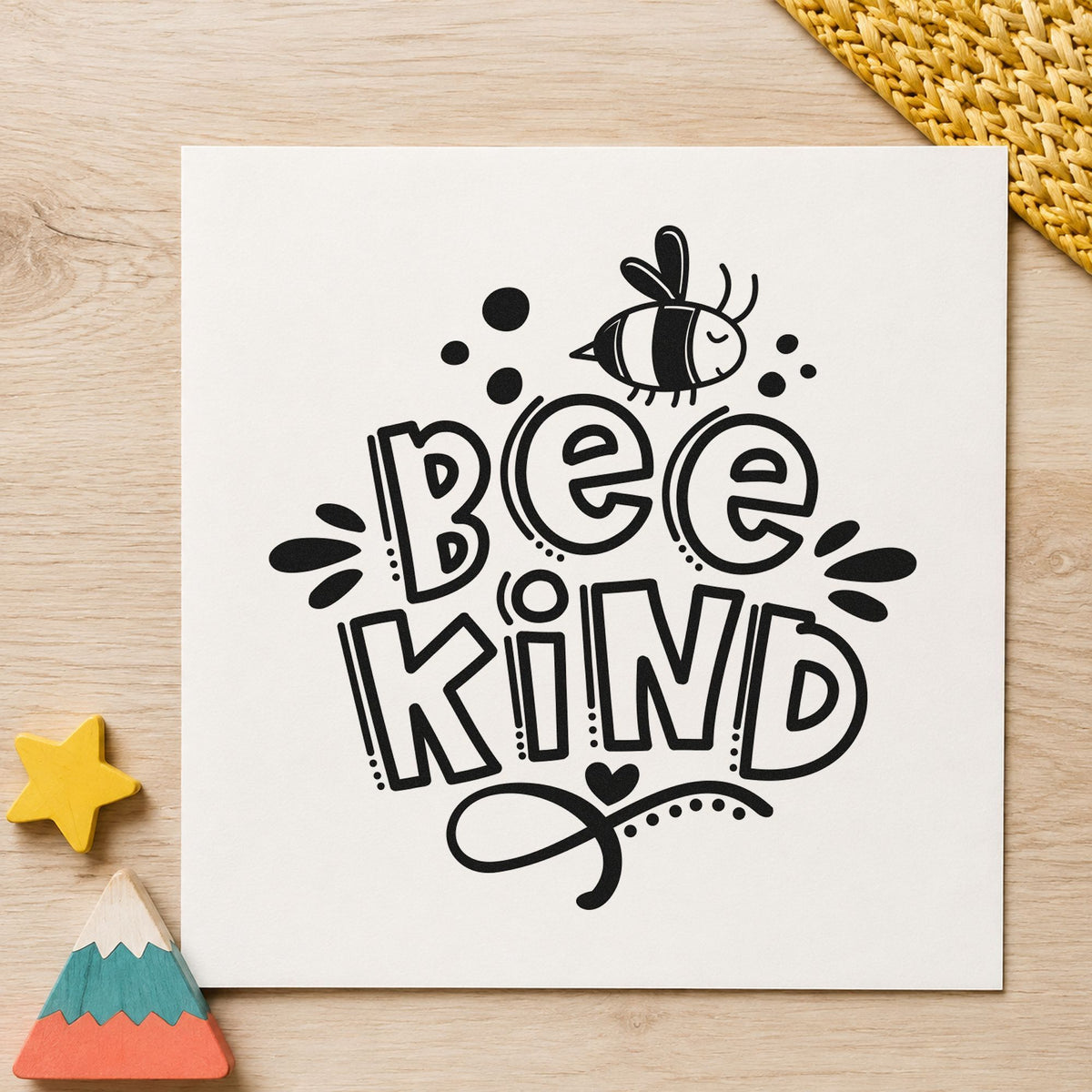 Bee Kind Bee Illustration craft stamp imprint in black ink on a handmade project, one idea being honey jar gift tags.