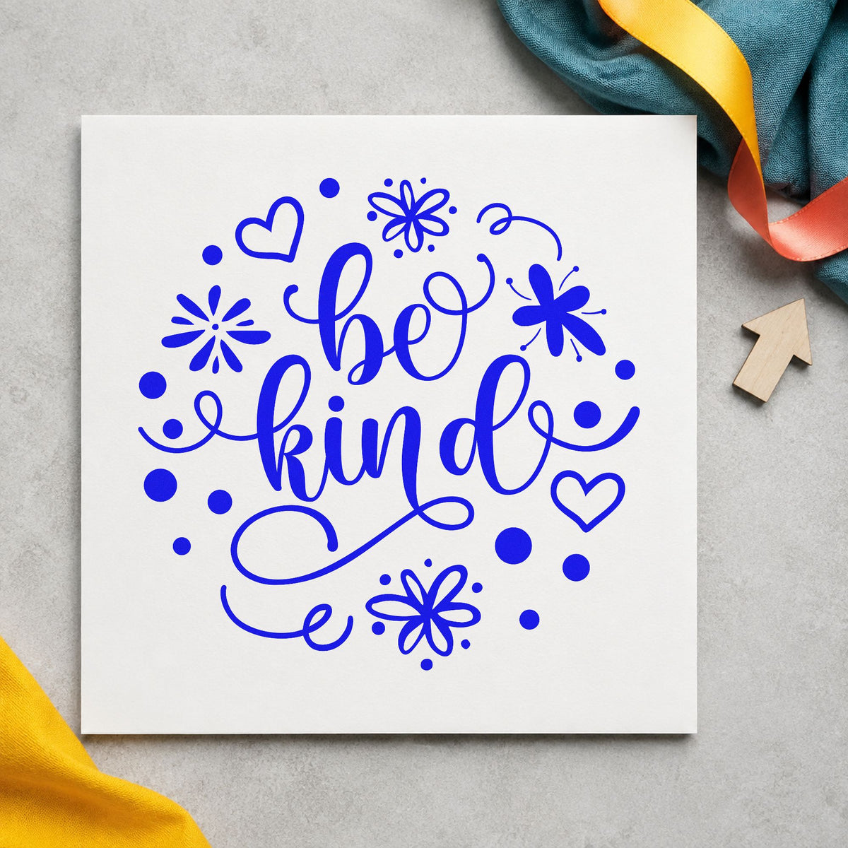 Be Kind Flowers Hearts craft stamp in blue ink on cardstock, an easy option for garden tote printing.