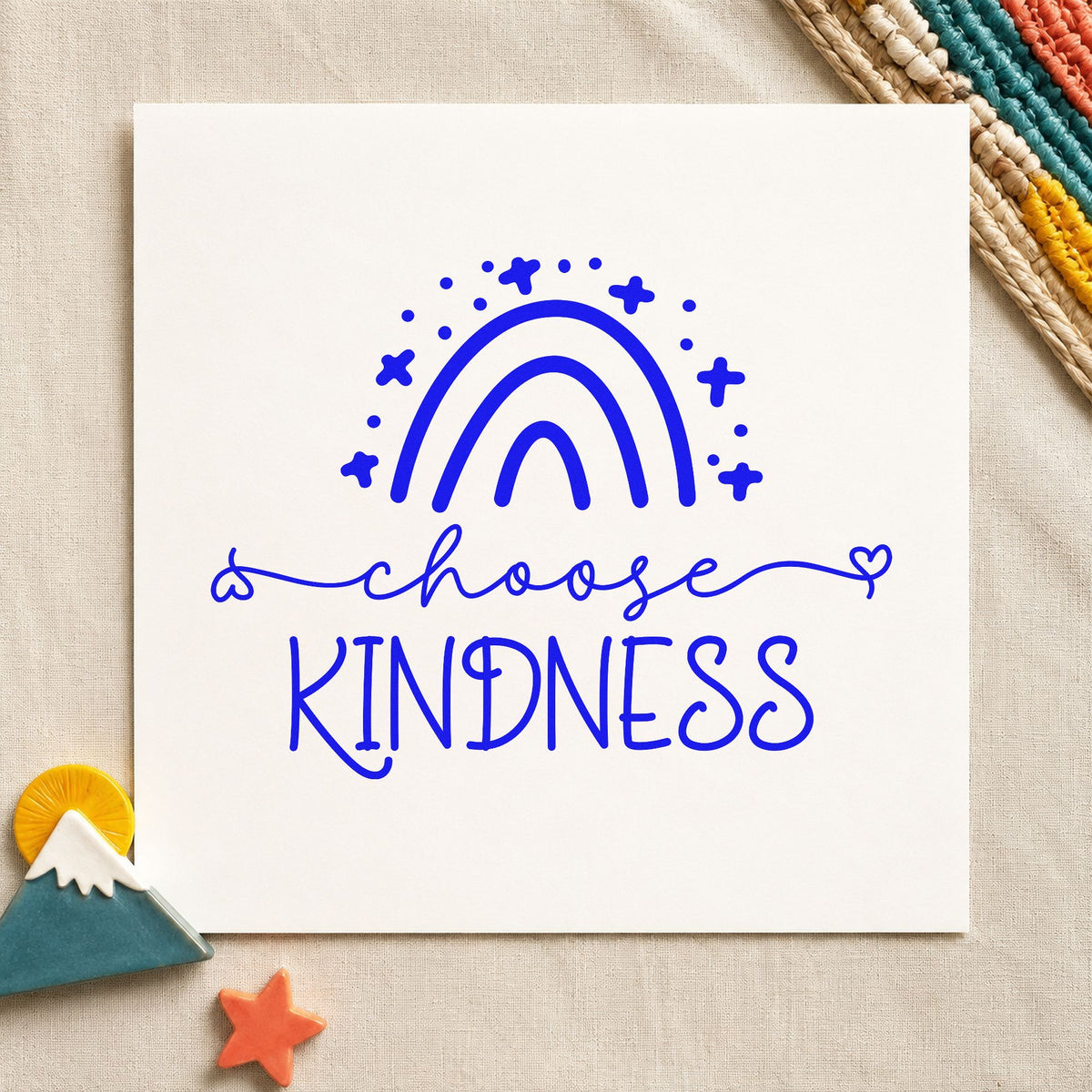Choose Kindness Starry Rainbow craft stamp imprinted in blue ink on paper, a design suited to framed children room.