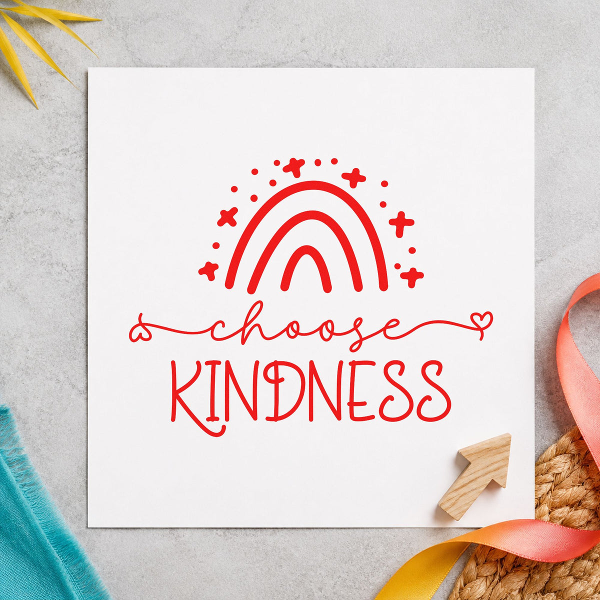 Choose Kindness Starry Rainbow rubber stamp shown in red ink, stamped for projects such as shelf age labels.