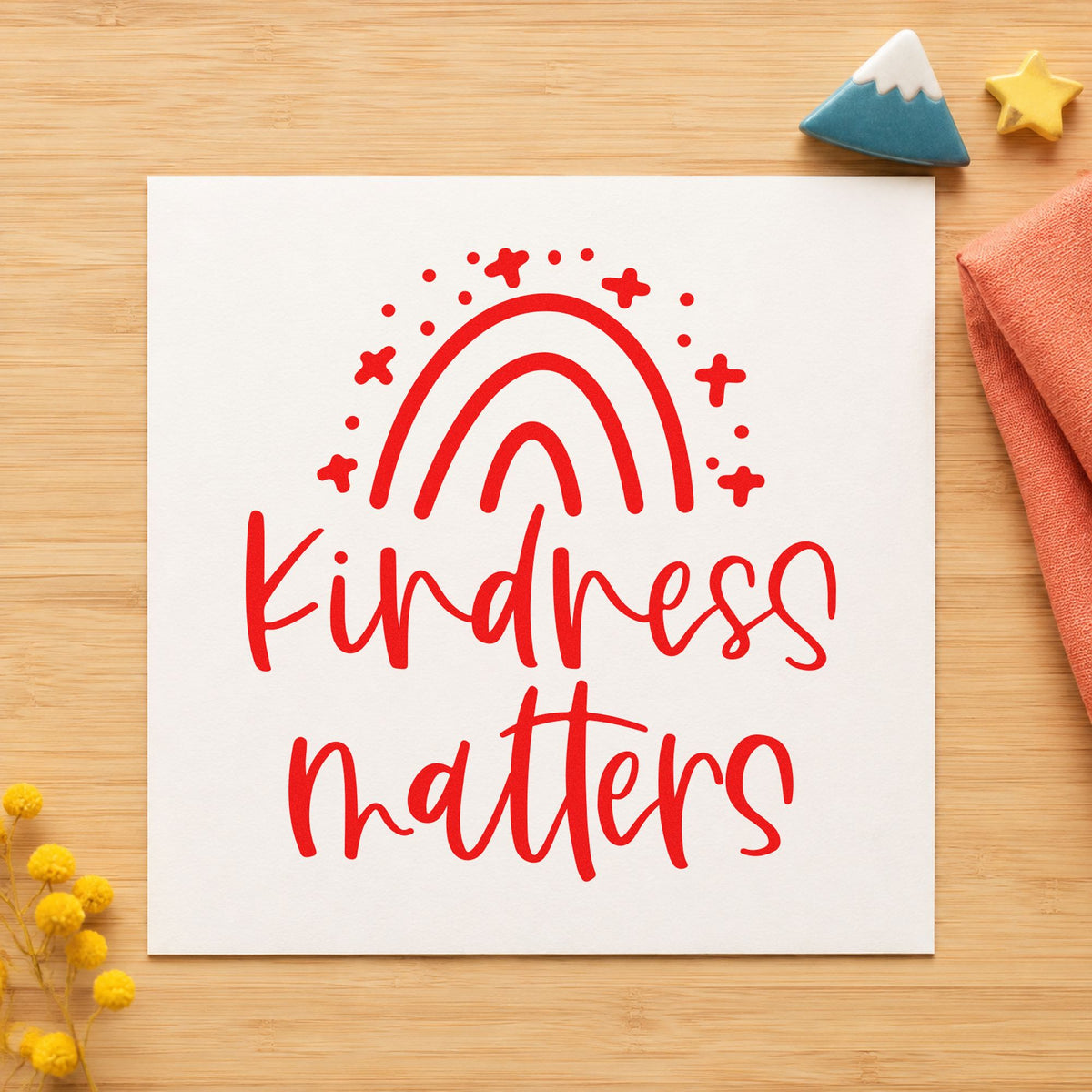 Kindness Matters Starry Rainbow rubber stamp shown in red ink, stamped for projects such as bin kit labels.