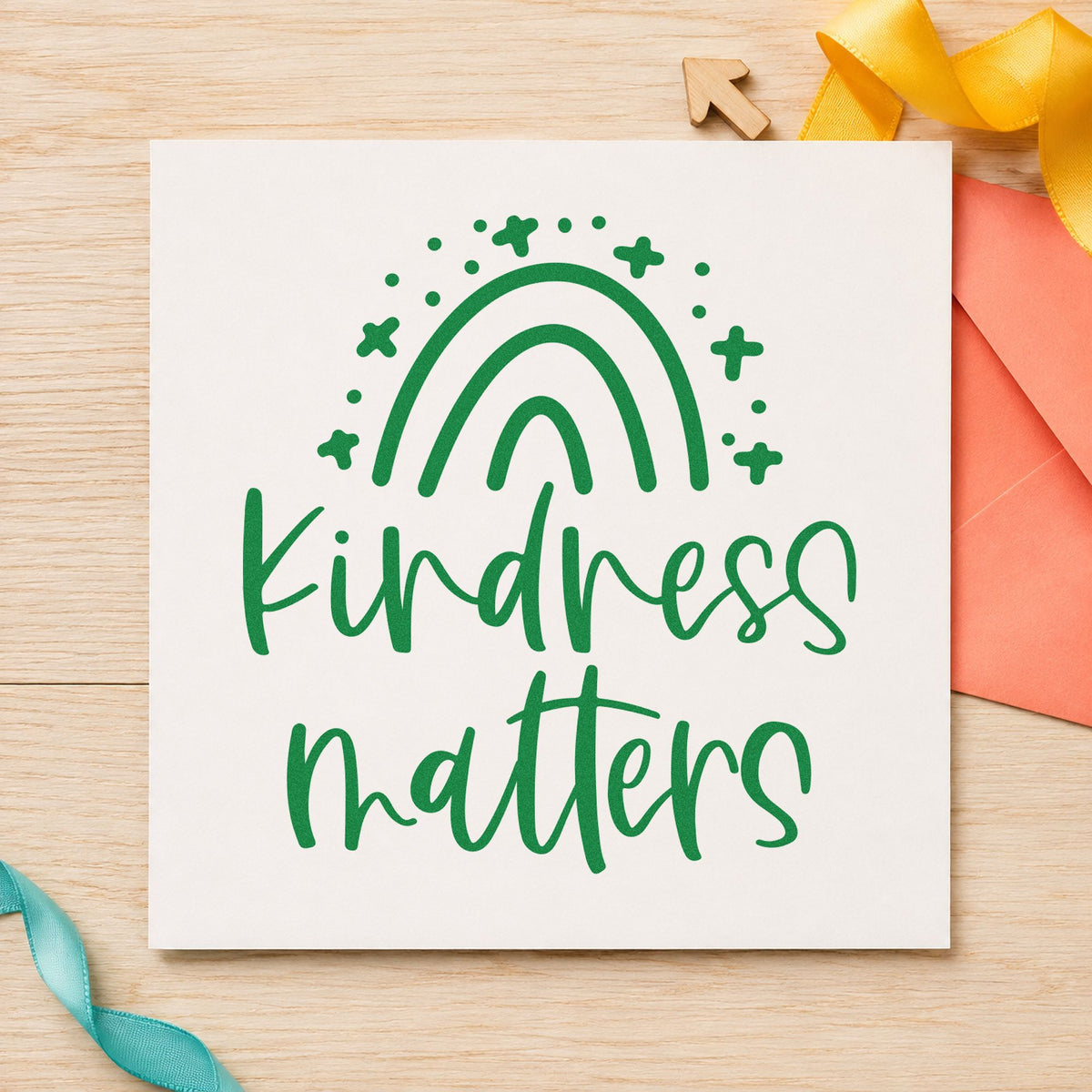 Kindness Matters Starry Rainbow craft stamp imprint in green ink on a handmade project, one idea being good sport cards.