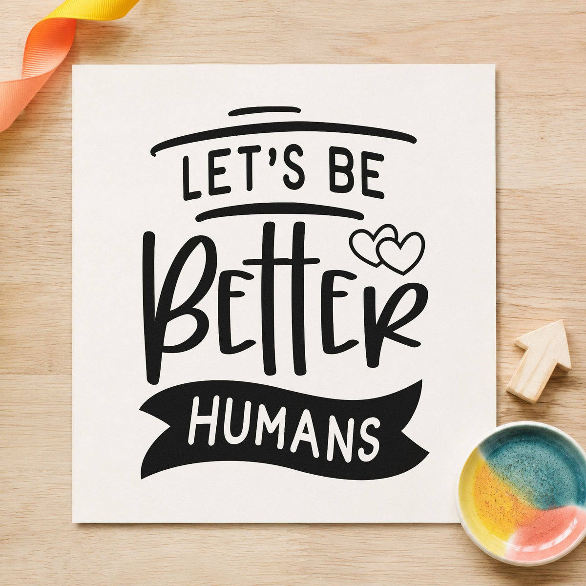 Let's Be Better Humans craft stamp in black ink on cardstock, an easy option for team year album page.
