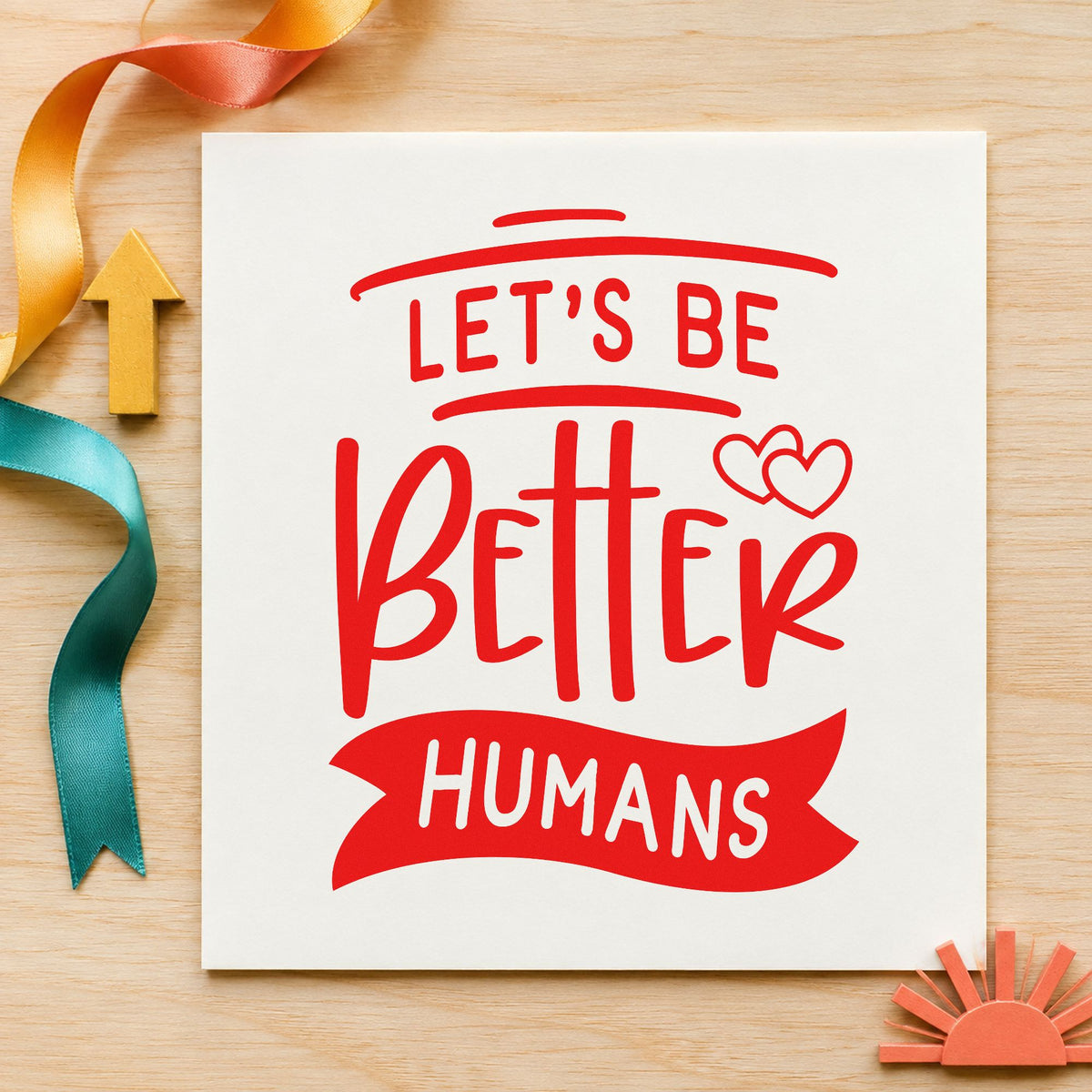 Let's Be Better Humans rubber stamp shown in red ink, stamped for projects such as shelf supply labels.