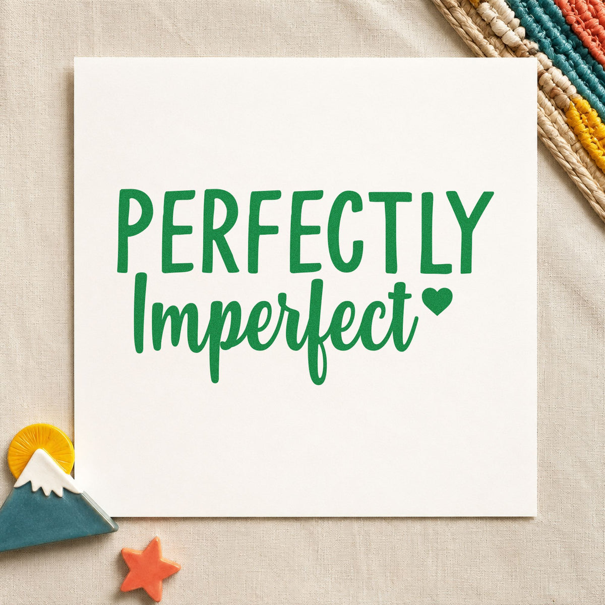 Perfectly Imperfect Small Heart craft stamp imprint in green ink on a handmade project, one idea being knit pattern cards.