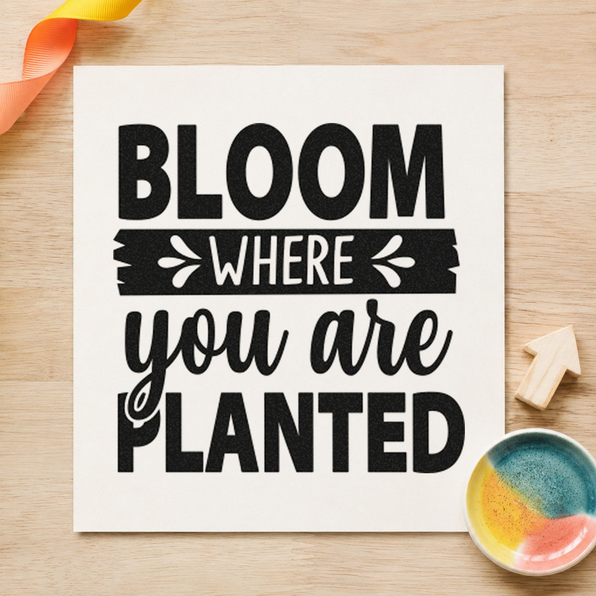 Bloom Where You Are Planted craft stamp imprint in black ink on a handmade project, one idea being pot gift tags.