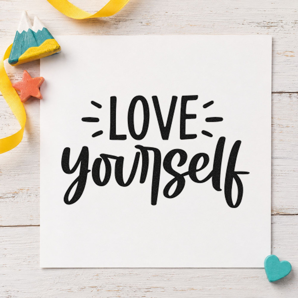 Love Yourself Bold Script craft stamp imprint in black ink on a handmade project, one idea being soap bar gift tags.