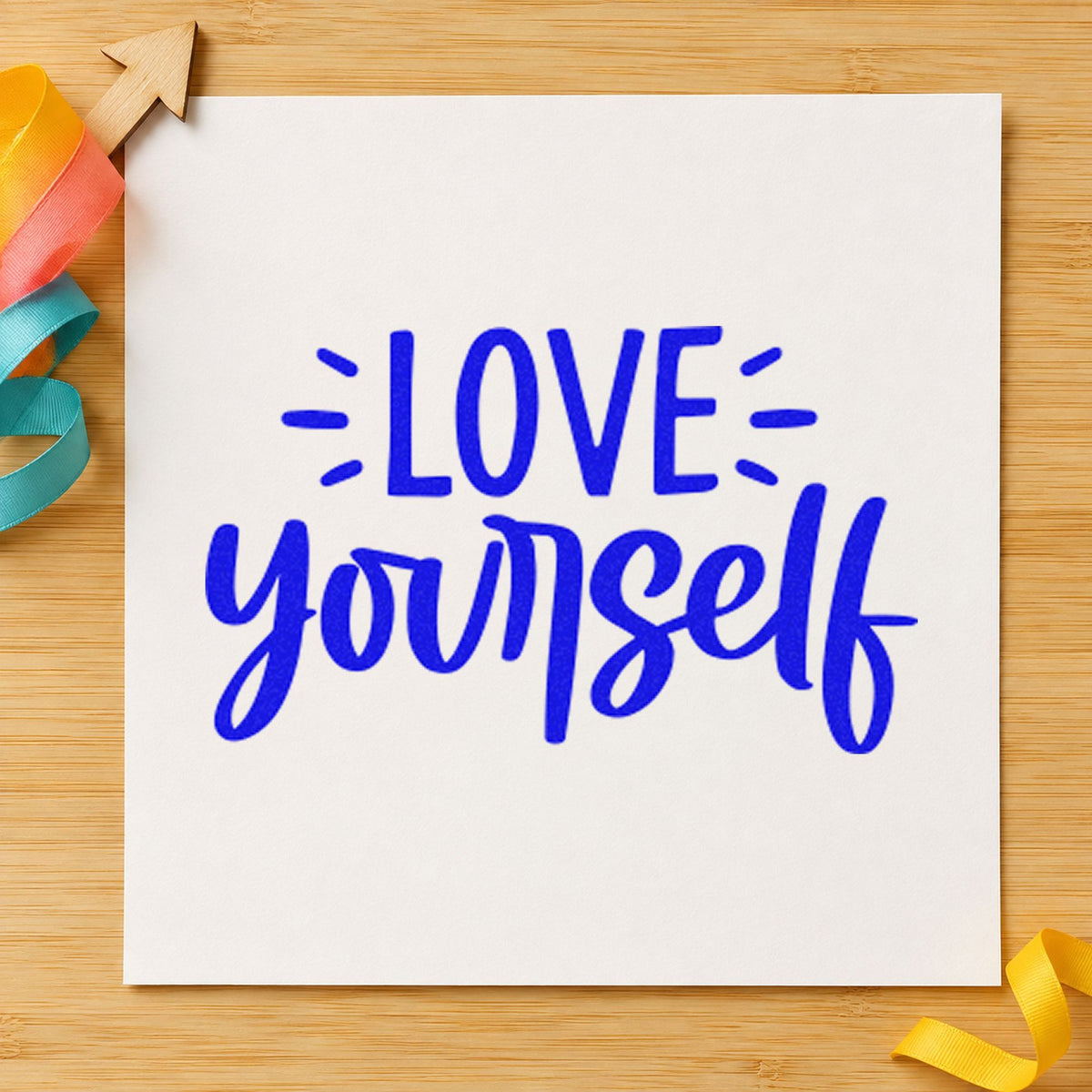 Love Yourself Bold Script craft stamp imprinted in blue ink on paper, a design suited to framed cure shelf.